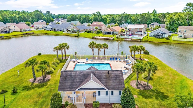 birds eye view of property with a water view