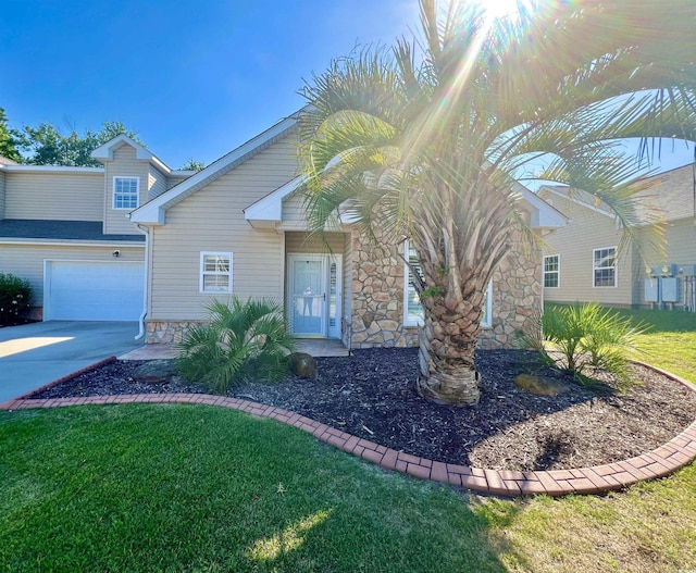 view of front of home with a garage and a front yard