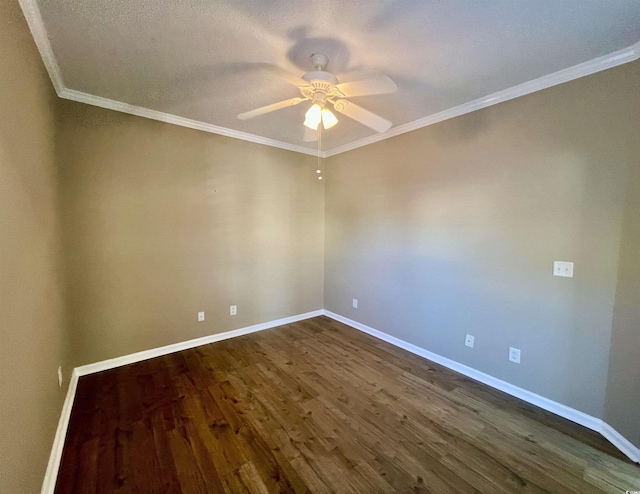 empty room with ornamental molding, dark wood-type flooring, and ceiling fan