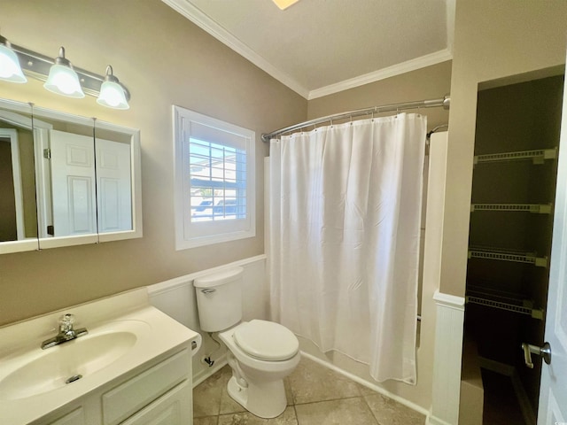 full bathroom featuring toilet, crown molding, vanity, shower / bath combo with shower curtain, and tile patterned flooring