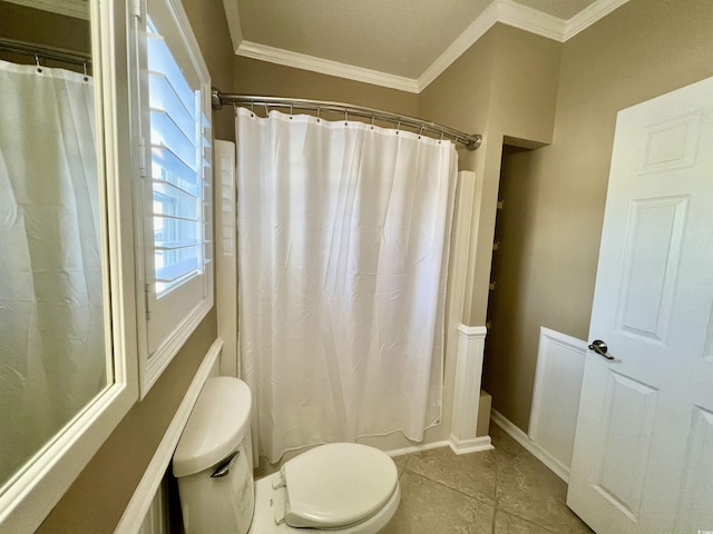 bathroom with crown molding, tile patterned floors, toilet, and shower / bath combination with curtain