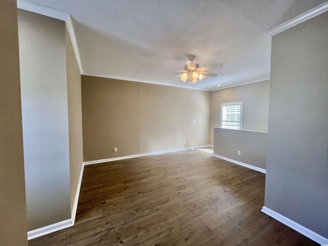 unfurnished room featuring crown molding, ceiling fan, and dark hardwood / wood-style flooring