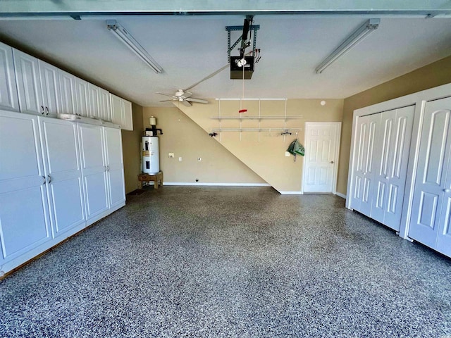 garage with a garage door opener, electric water heater, and ceiling fan