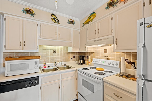 kitchen with a textured ceiling, sink, white appliances, and ornamental molding