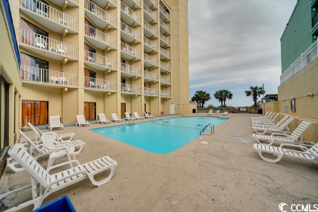 view of pool featuring a patio area