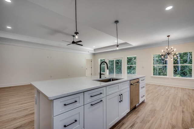 205 Brush Ct, Little River, SC 29566 - kitchen with a sink, stainless steel dishwasher, light wood-style flooring, a tray ceiling, and ornamental molding