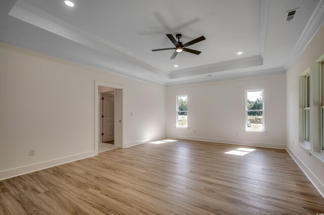 205 Brush Ct, Little River, SC 29566 - spare room with a tray ceiling, crown molding, a ceiling fan, light wood finished floors, and recessed lighting