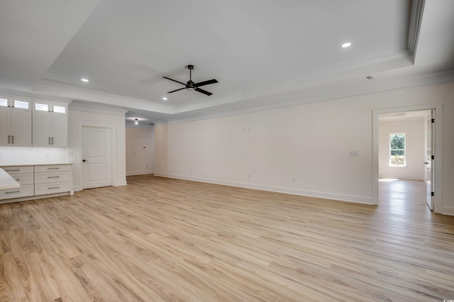 205 Brush Ct, Little River, SC 29566 - unfurnished living room with a raised ceiling, ornamental molding, a ceiling fan, light wood finished floors, and recessed lighting