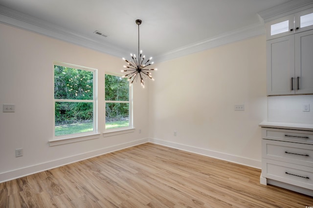 205 Brush Ct, Little River, SC 29566 - unfurnished dining area featuring crown molding, a chandelier, light wood-style floors, plenty of natural light, and baseboards