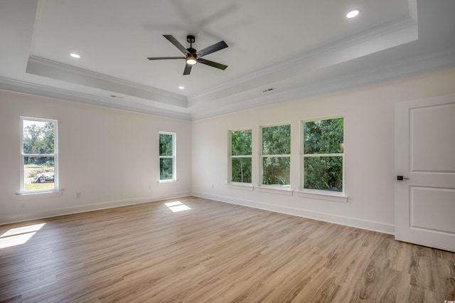 205 Brush Ct, Little River, SC 29566 - spare room featuring a raised ceiling, ornamental molding, light wood-style flooring, recessed lighting, and baseboards