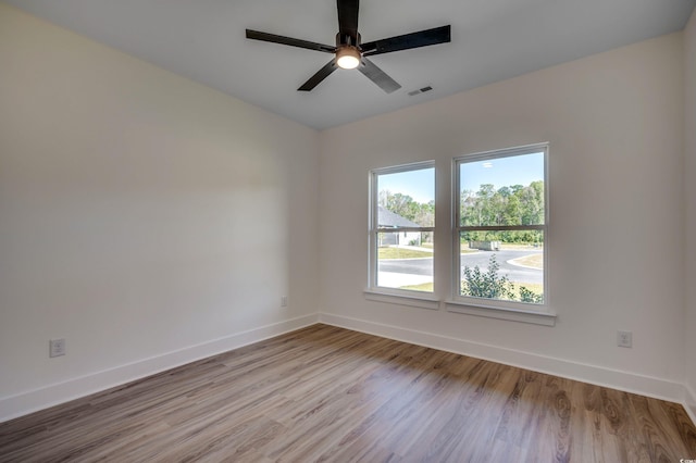 205 Brush Ct, Little River, SC 29566 - spare room featuring baseboards, wood finished floors, and ceiling fan
