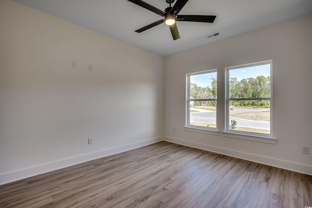 205 Brush Ct, Little River, SC 29566 - unfurnished room featuring baseboards, wood finished floors, and a ceiling fan