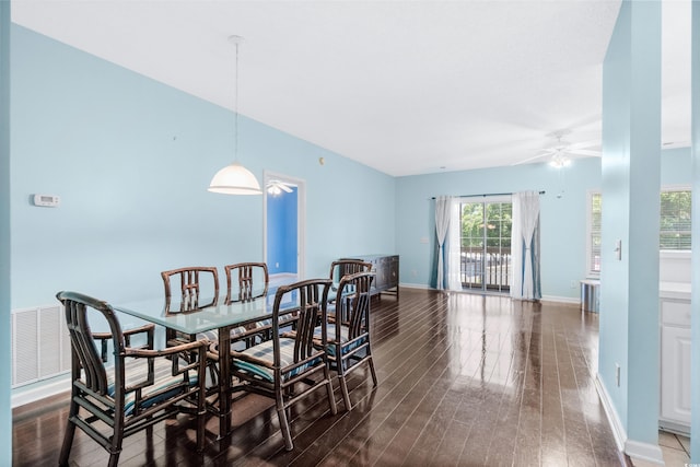 dining area with dark hardwood / wood-style floors and ceiling fan