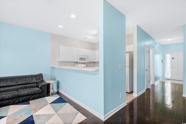 living room with light hardwood / wood-style flooring