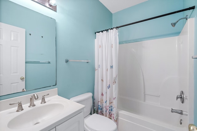 full bathroom featuring shower / bath combination with curtain, toilet, and vanity