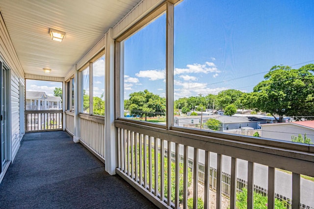 unfurnished sunroom with a healthy amount of sunlight