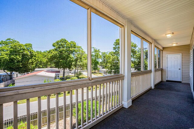 unfurnished sunroom featuring plenty of natural light