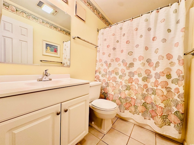 bathroom featuring tile flooring, oversized vanity, and toilet