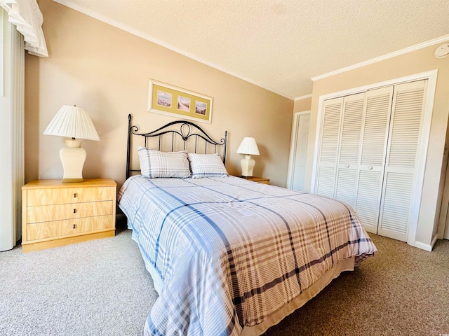 carpeted bedroom with a closet, a textured ceiling, and crown molding