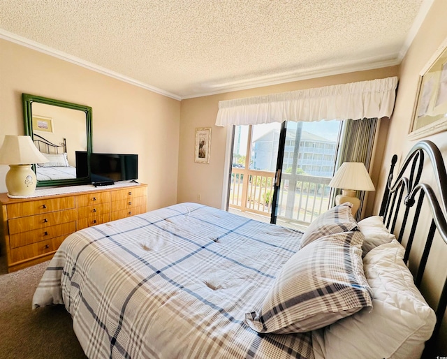 carpeted bedroom featuring access to exterior and a textured ceiling