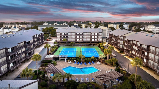 view of pool at dusk