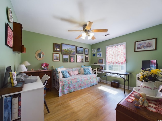 bedroom with light wood-type flooring and ceiling fan