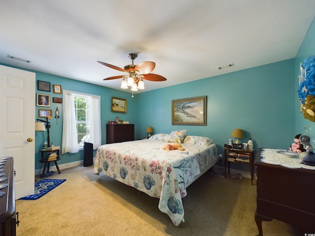 bedroom featuring light carpet and ceiling fan