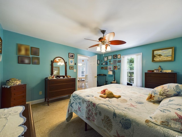 carpeted bedroom featuring ceiling fan