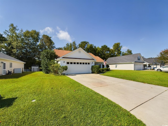 ranch-style house featuring a front yard and a garage