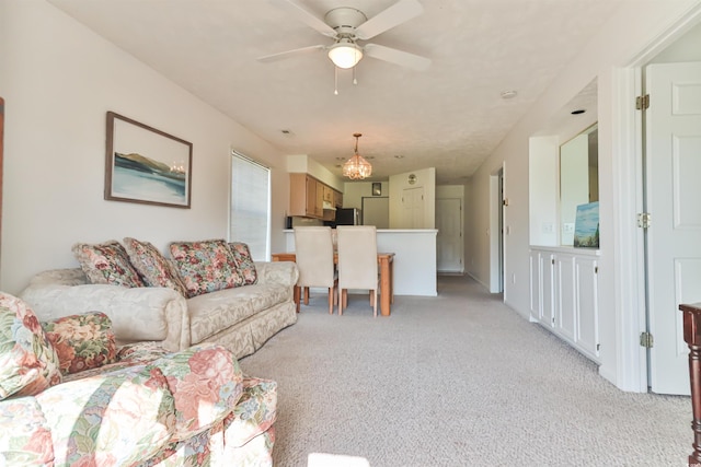 living room with ceiling fan and light colored carpet