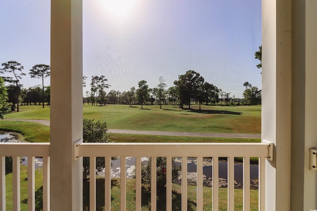 view of yard with a balcony