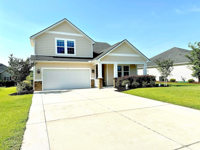 craftsman house featuring a garage and a front yard