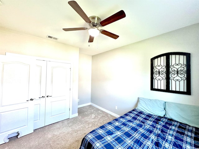 unfurnished bedroom with a closet, carpet, and ceiling fan