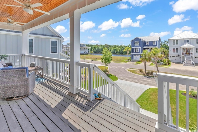 deck with a porch and ceiling fan