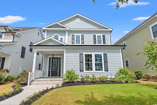 view of front of home featuring a front lawn and a porch