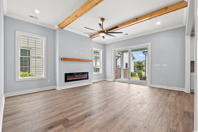 unfurnished living room with crown molding, ceiling fan, beam ceiling, and light hardwood / wood-style floors