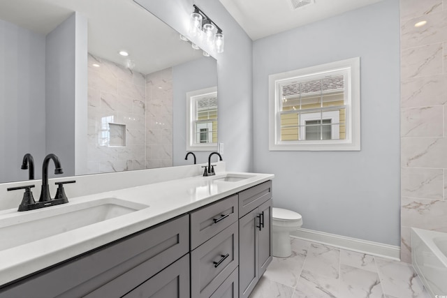 full bathroom with vanity, toilet, and separate shower and tub