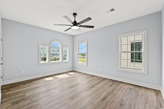 spare room featuring ceiling fan and light hardwood / wood-style floors