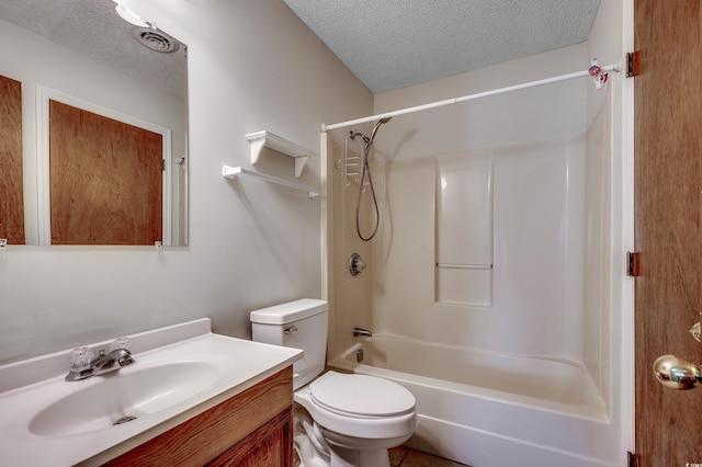 full bathroom featuring washtub / shower combination, toilet, a textured ceiling, and vanity