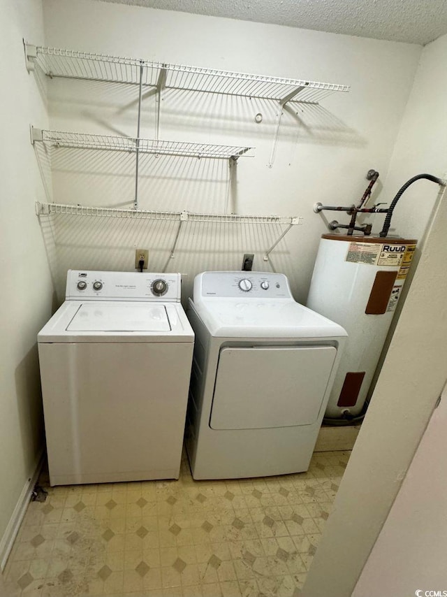 washroom featuring gas water heater and independent washer and dryer