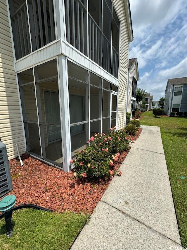 view of property exterior with a lawn