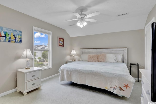 carpeted bedroom featuring ceiling fan and lofted ceiling