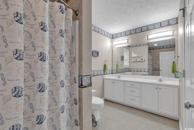 bathroom with vanity, a textured ceiling, tile patterned flooring, toilet, and curtained shower