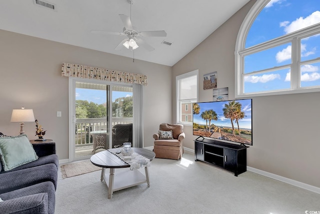 living room featuring light carpet, ceiling fan, and high vaulted ceiling