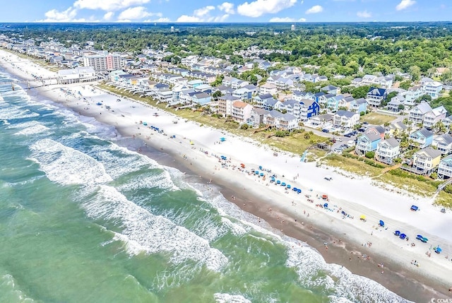 aerial view with a water view and a beach view