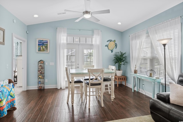 dining space featuring lofted ceiling, dark hardwood / wood-style flooring, ceiling fan, and plenty of natural light