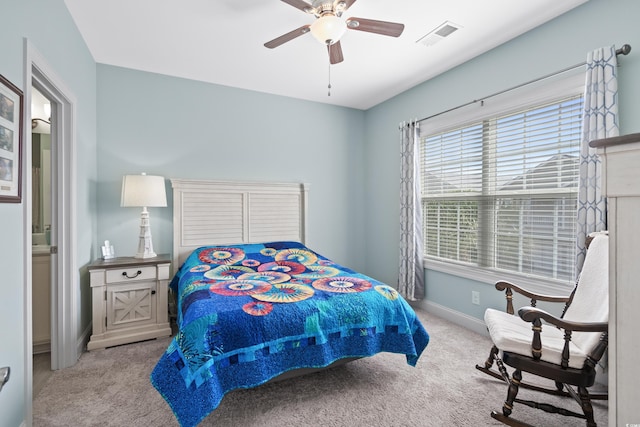 bedroom featuring light carpet and ceiling fan