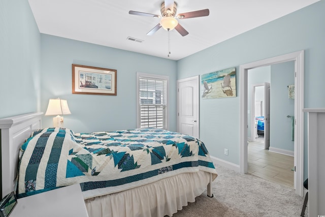 carpeted bedroom with a closet and ceiling fan