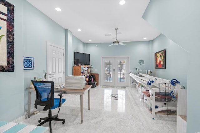 office space with french doors, a towering ceiling, and ceiling fan