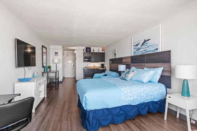 bedroom featuring dark wood-type flooring